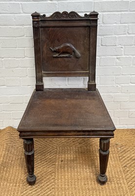 Lot 1045 - AN ANTIQUE OAK HALL CHAIR WITH CARVED BEAVER