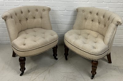 Lot 660 - A PAIR OF LOW CHAIRS UPHOLSTERED IN NEUTRAL BUTTON BACK FABRIC