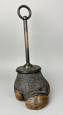Lot 555 - AN ANTIQUE RHINO FOOT DOOR STOP