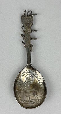 Lot 303 - AN UNUSUAL SILVER OR SILVER PLATED SPOON WITH ENGRAVED STAG AND SUN ON BOWL, AND HOOPS TO HANDLE