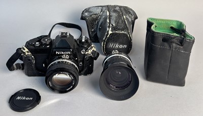 Lot 564 - A NIKON 35MM SLR CAMERA WITH 50MM LENS AND 28MM WIDE ANGLE LENS