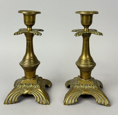 Lot 1109 - A PAIR OF ANTIQUE BRASS CANDLESTICKS