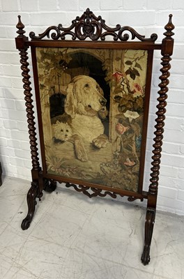 Lot 1074 - A VICTORIAN MAHOGANY FIRE SCREEN WITH EMBROIDERED PANEL DEPICTING A DOG