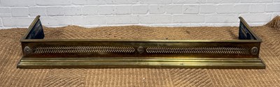 Lot 1055 - AN ANTIQUE BRASS FIRE FENDER