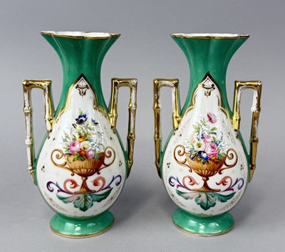 Lot 652 - A PAIR OF CLASSICAL PAINTED PORCELAIN VASES WITH REEDED HANDLES