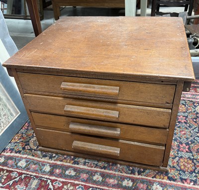 Lot 1031 - A DECO FOUR DRAWER CHEST HOUSING A MECCANO SET