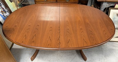 Lot 1014 - A G-PLAN EXTENDING TEAK DINING TABLE