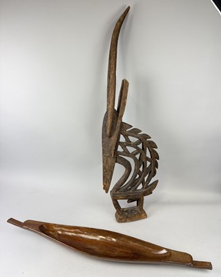 Lot 585 - A CARVED WOODEN TRIBAL FIGURE AND A CARVED WOODEN BOAT