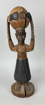 Lot 100 - AN AFRICAN TRIBAL YORUBA FIGURE OF MOTHER EARTH AND WISDOM, HOLDING GLOBE OVER HER HEAD, YORUBA PEOPLE, NIGERIA, EARLY 20TH CENTURY