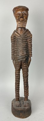 Lot 84 - A SCULPTURE OF A TALL BEARDED MALE FIGURE IN PRISON UNIFORM, POSSIBLY NORDIC