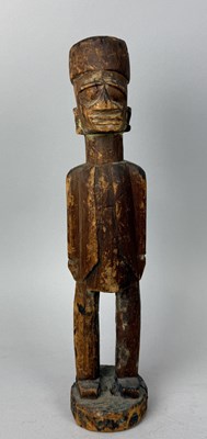 Lot 128 - A YORUBA CARVED LIGHT WOOD STANDING FIGURE OF A LOCAL MUSLIM MAN, YORUBA PEOPLE, NIGERIA, EARLY 20TH CENTURY