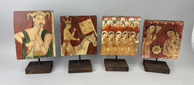 Lot 68 - A GROUP OF FOUR MOUNTED SRI LANKAN PAINTINGS ON WOODEN PANELS DEPICTING BUDDHIST AND COURT SCENES, SRI LANKA, EARLY 20TH CENTURY