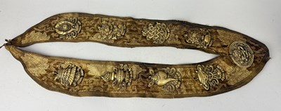 Lot 104 - A TIBETAN PRIEST'S CHEST ORNAMENT WITH NINE CAST BRASS PLAQUES, TIBET