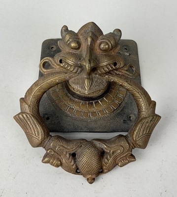 Lot 66 - AN INDIAN OR SRI LANKAN CAST BRASS TEMPLE DOOR KNOCKER, SOUTH INDIA OR SRI LANKA, 19TH CENTURY