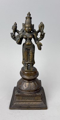 Lot 122 - AN INDIAN BRONZE STANDING FIGURE OF LAKSHMI, SOUTH INDIA, CIRCA 1900