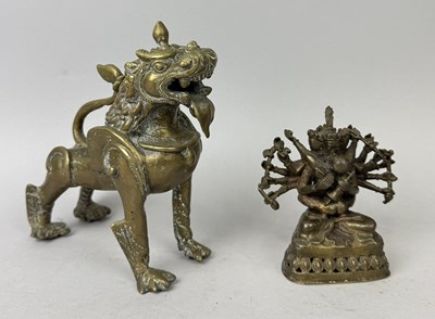 Lot 121 - TWO CAST BRASS NEPALESE TEMPLE FIGURES, ONE OF A DEITY IN YAG-YUM, THE OTHER OF A TEMPLE LION, NEPAL, EARLY 20TH CENTURY