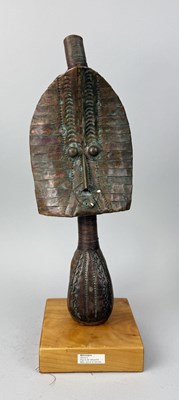 Lot 25 - AN AFRICAN KOTA ANCESTRAL GUARDIAN FIGURE, WRAPPED IN COPPER STRIPS AND COPPER WIRE OVER A WOOD BASE