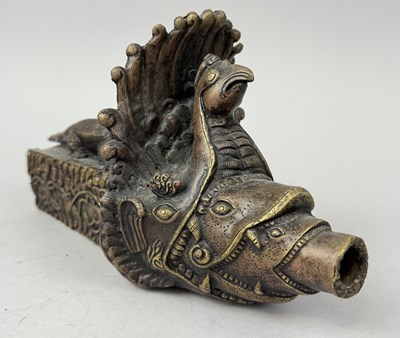 Lot 44 - A NEPALESE BRASS WATER SPOUT, NEPAL, EARLY 20TH CENTURY