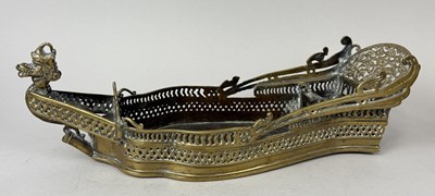 Lot 47 - AN INDONESIAN BRASS BETEL BOX IN THE FORM OF AN EARLY BOAT WITH PIERCED SIDE, SOUTH SUMATRA, INDONESIA, 18TH-19TH CENTURY