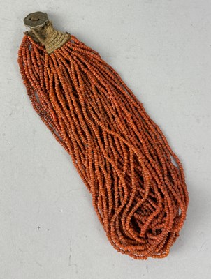 Lot 151 - NAGA MULTI-STRAND NECKLACE OF GLASS TRADE BEADS WITH AN INDIAN COIN CLOSURE, INDIA, 20TH CENTURY