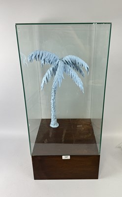 Lot 1170 - A BLUE TACK PALM TREE SCULPTURE IN GLASS CASE ON WOODEN STAND