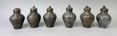 Lot 19 - A COLLECTION OF SIX THAI OR CAMBODIAN SILVER LIDDED VASES, THAILAND OR CAMBODIA, CIRCA 1920