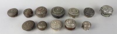 Lot 11 - A COLLECTION OF 12 FINE SILVER LIDDED BETEL BOXES, THAI, BURMESE, STRAITS CHINESE, ALL 19TH-EARLY 20TH CENTURY (12)