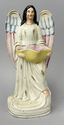 Lot 493 - STAFFORDSHIRE, ANGEL HOLDING A WICKER BASKET, CIRCA 1870'S