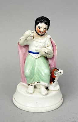 Lot 497 - STAFFORDSHIRE, SAINT LUKE SITTING WITH AN OX, CIRCA 1830'S