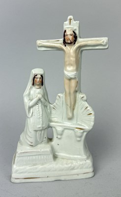Lot 500 - STAFFORDSHIRE, A NUN KNEELING AND PRAYING BY CRUCIFIXION, CIRCA 1870'S