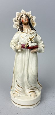 Lot 502 - STAFFORDSHIRE, JESUS WITH CUP, CROSS AND LAMB, AND A STAR SHAPED HALO, CIRCA 1860'S
