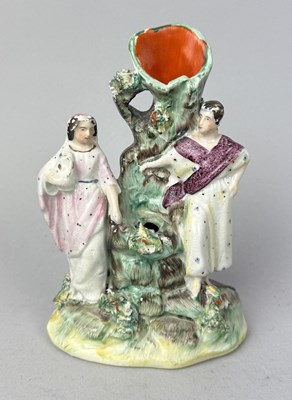 Lot 505 - STAFFORDSHIRE, PROBABLY JESUS AND THE WOMAN OF SAMARIA STANDING ON EACH SIDE OF A WELL WITH TREE SPILL HOLDER, CIRCA 1860'S