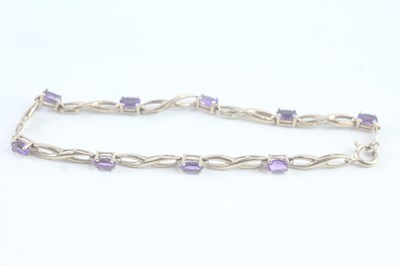 Lot 110 - A 9CT GOLD AMETHYST BRACELET