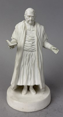 Lot 525 - AN EARLY 19TH CENTURY WHITE CERAMIC MODEL OF A PREACHER