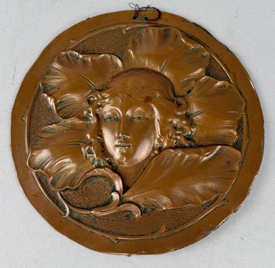 Lot 677 - AN ART NOUVEAU BRONZED ROUNDEL DEPICTING A GIRL EMERGING FROM A FLOWER