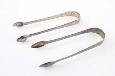 Lot 357 - TWO .925 GEORGIAN STERLING SILVER SUGAR TONGS