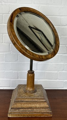 Lot 1107 - AN EARLY 20TH CENTURY WALNUT VENEER REVOLVING DRESSING MIRROR ON STAND