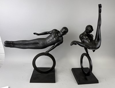 Lot 577 - A PAIR OF METALLIC COMPOSITE SCULPTURES OF GYMNASTS