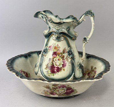 Lot 1212 - A CERAMIC JUG AND STAND PAINTED WITH FLOWERS