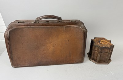 Lot 1185 - A BROWN LEATHER SUITCASE ALONG WITH A CURVED-EDGE MARQUETRY INLAY CADDY