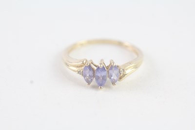 Lot 177 - A 9CT GOLD MARQUISE CUT TANZANITE AND DIAMOND DRESS RING