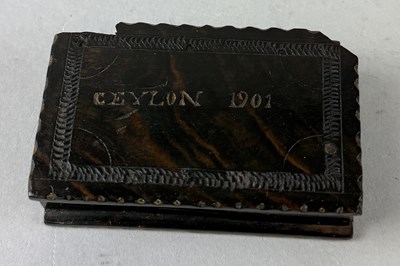 Lot 609 - BOER WAR, DIYATALAWA CAMP, CEYLON: A CARVED EBONY MATCHBOX