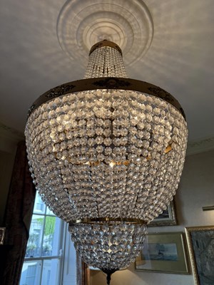 Lot 947 - A FRENCH BRASS AND CRYSTAL CHANDELIER WITH ADJUSTABLE DROP