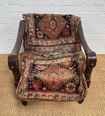 Lot 1098 - A MOROCCAN SADDLE CHAIR, WITH CARPET COVER