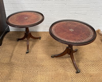 Lot 1095 - A PAIR OF REPRODUCTION WINE TABLES WITH TOOLED LEATHER TOPS