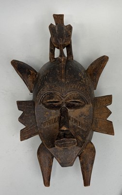 Lot 642 - AN AFRICAN IVORY COAST TRIBAL SENUFO MASK