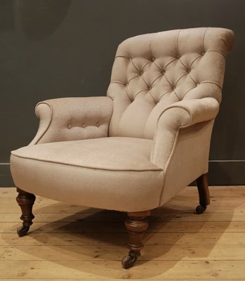 Lot 975 - A 19TH CENTURY ENGLISH ARMCHAIR IN THE MANNER OF HOWARD & SONS ON TURNED WALNUT LEGS