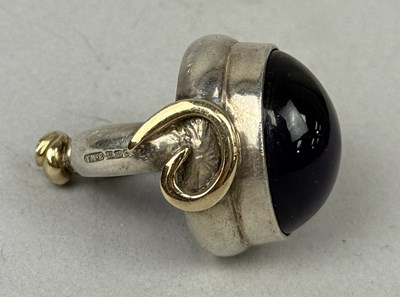 Lot 392A - TOM MCEWAN: A STERLING SILVER RING SET WITH AN AMETHYST