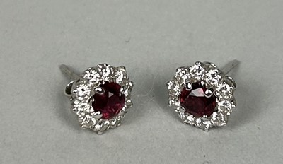 Lot 52 - A PAIR OF WHITE GOLD CLUSTER EARRINGS EACH SET WITH A RUBY AND TEN DIAMONDS