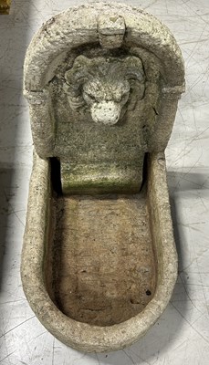 Lot 640 - A HEAVY STONE FOUNTAIN WITH CARVED LIONS HEAD BACK